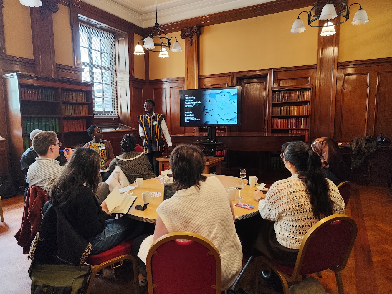 Charlie Cobbinah presenting at an academic event